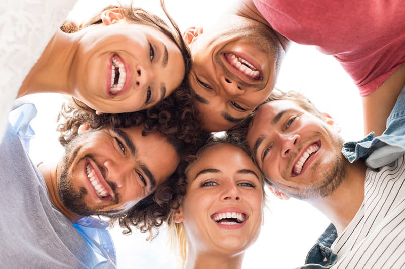 A group of people smiling and having fun